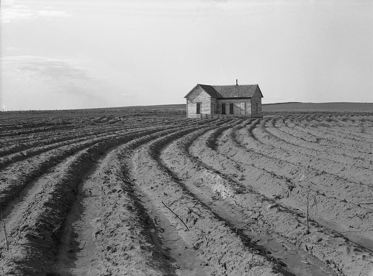 Mechanized farming displacing tenant farmers in Childress County, Texas Panhandle, 1938 — a tractor working open farmland on the North Texas plains