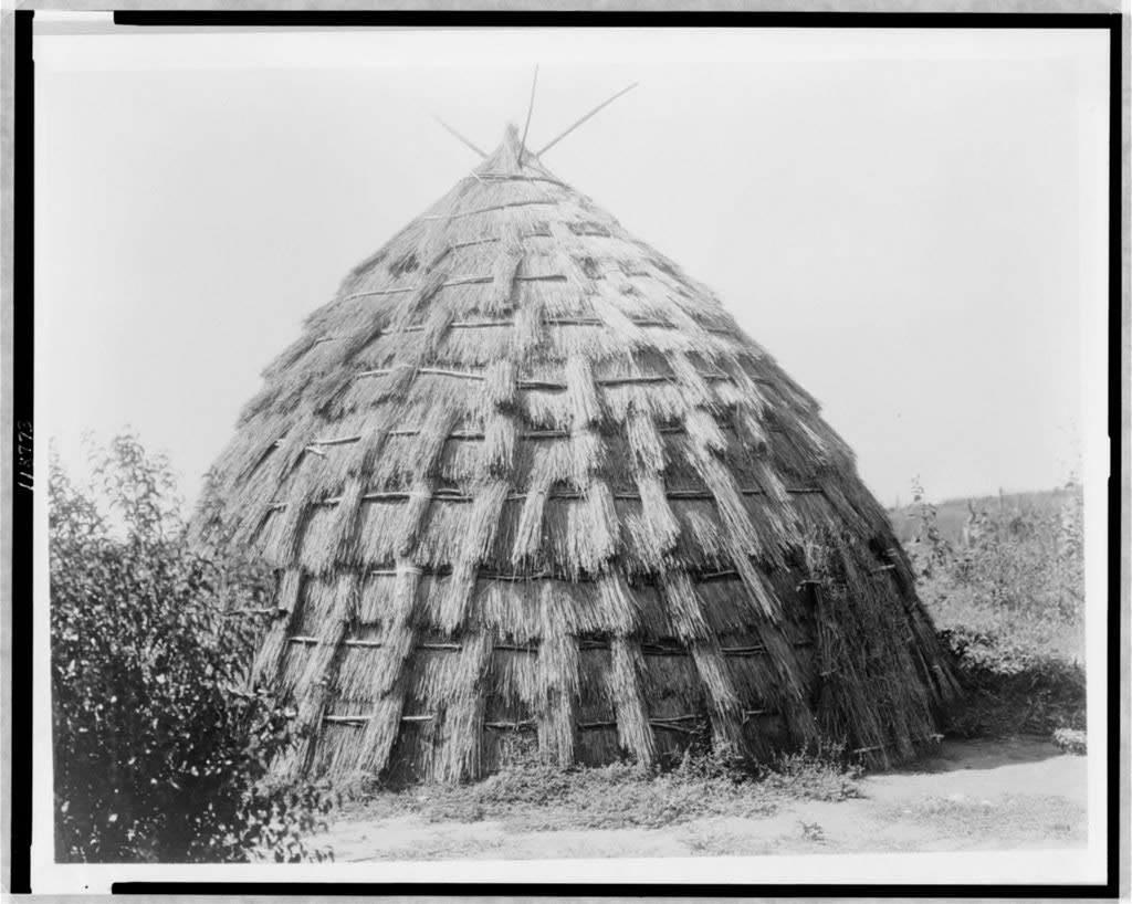 Wichita grass-house, photographed by Edward S. Curtis c.1927, showing the traditional architectural form of the Wichita (Taovaya) peoples who inhabited the Red River region including what is now Montague County