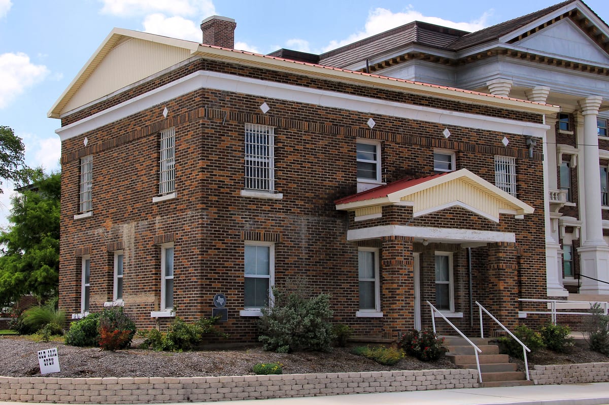 The 1927 brick Old Montague County Jail in Montague, Texas, photographed June 2014